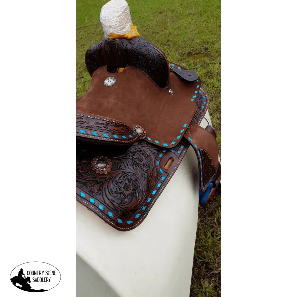 10" Double T  Pony hard seat barrel style saddle with turquoise buckstitch trim.